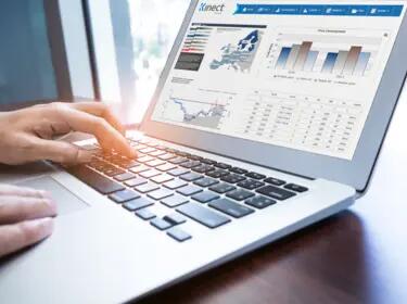 laptop with graphs on the screen