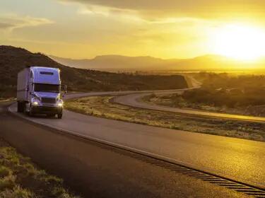 Truck in highway w sunset