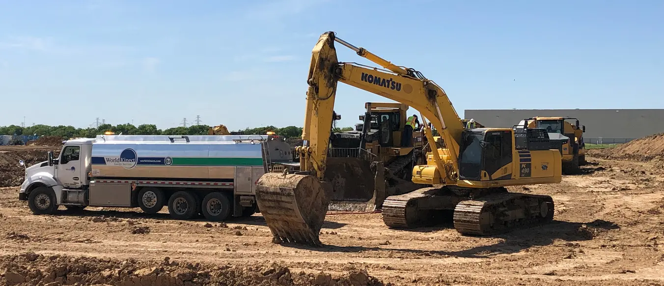 fuel truck at construction site with yellow bull dozer v2