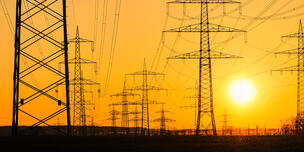 sun over power lines