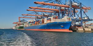 Container ship unloading at port