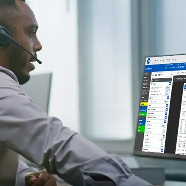 man at computer viewing flight plans