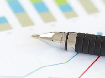 pen overtop of a report