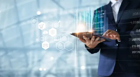 Business man analyzing data on tablet