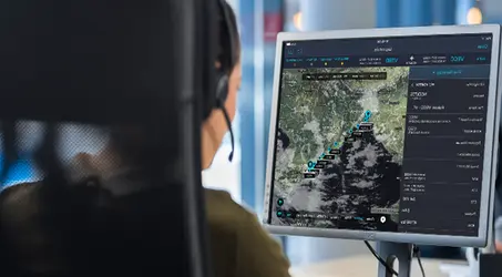 women sitting at computer viewing map