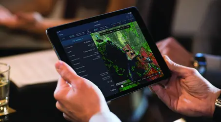 man holding iPad