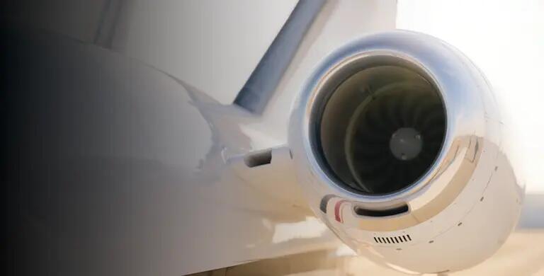 Looking up at the front of the engine of a business jet
