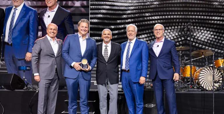 guys in suits receive award