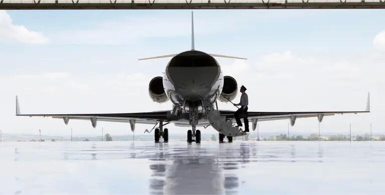 pilot entering jet