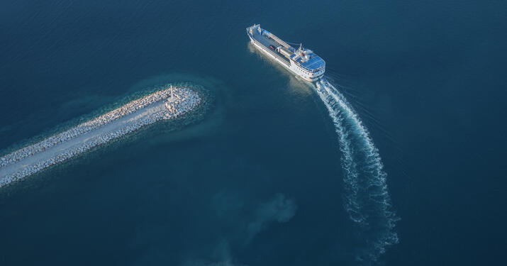 Car Carrier Vessel Turning around pier above view