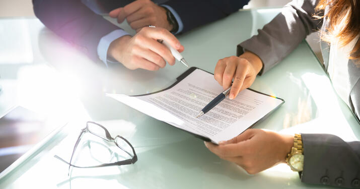 PErsona at desk looking at documents