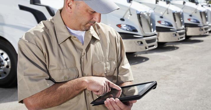 Truck driver using tablet