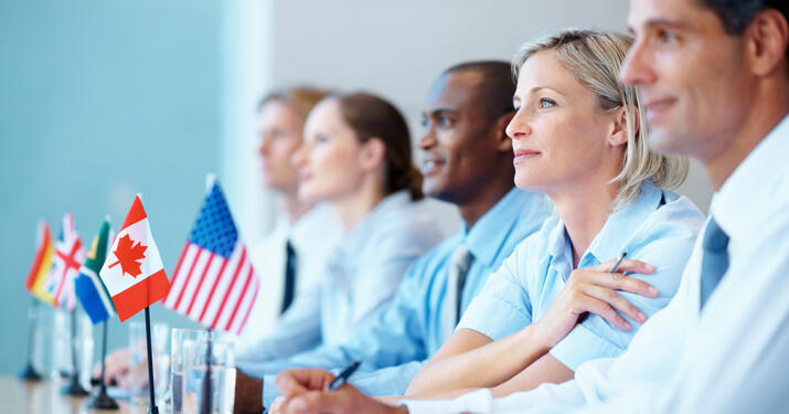 group of professionals seating on a table looking ahead