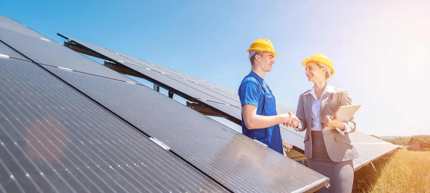 shaking hands solar panel