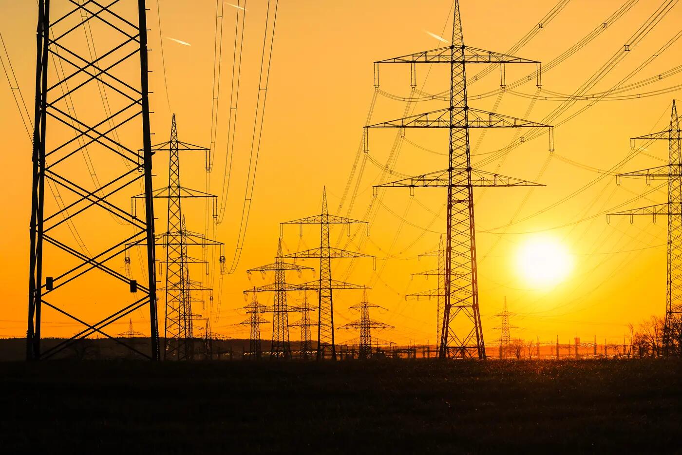 sun over power lines