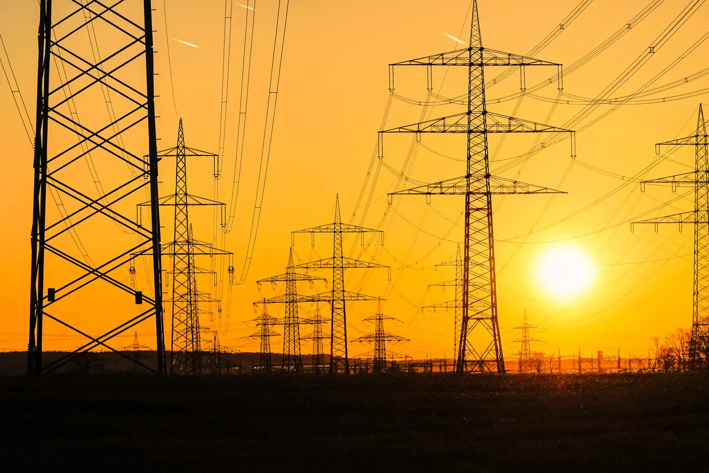sun over power lines
