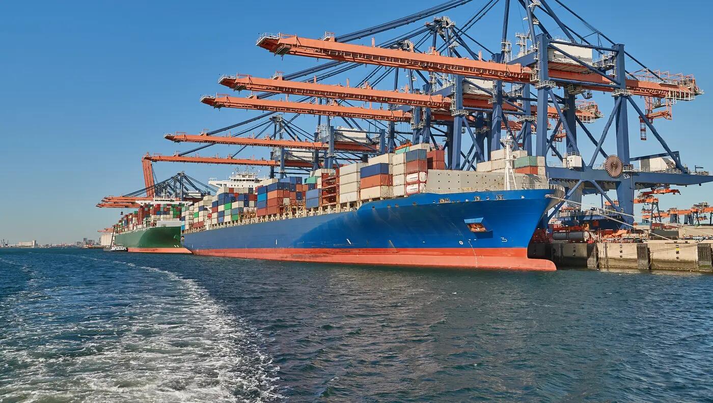 Container ship unloading at port