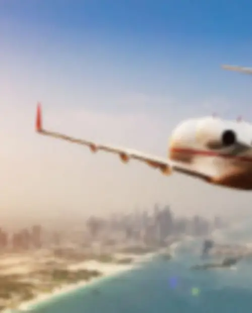 business jet flying into a city